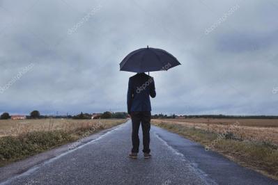 Depositphotos 88311888 stock photo businessman standing with umbrella